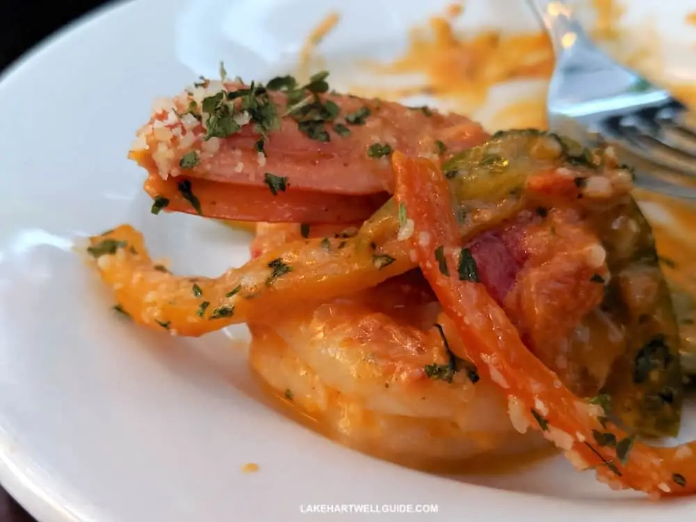 Beautifully plated seafood and vegetables.